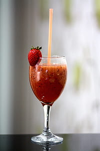 clear wine glass with strawberry juice thumbnail