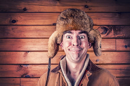 man wearing brown earpluff painiting thumbnail