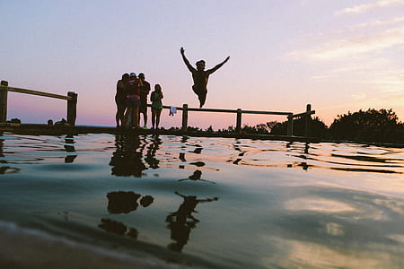 person jumping on pool thumbnail