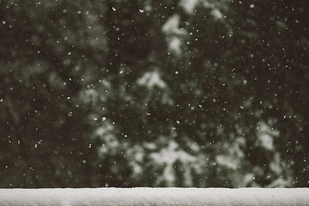 snow flakes falling on window frame thumbnail