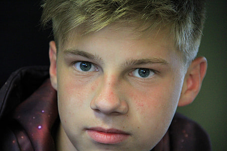 close up of man in brown hoodie thumbnail