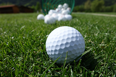shallow focus photography of white golf ball outdoors thumbnail