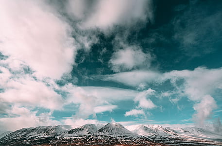 mountains and clouds during daytime thumbnail