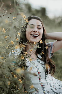 woman beside flowers thumbnail