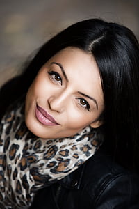 woman in brown and black leopard skin print scarf thumbnail