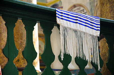 white and blue banner on green wooden rail thumbnail