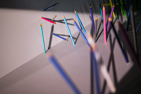 Pencils and crayons sticking out of the walls and floors thumbnail