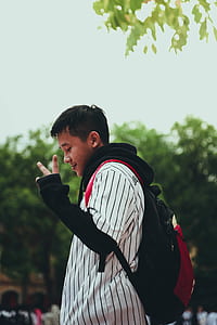 Boy in Peace Sign thumbnail
