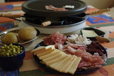 sliced of cheese and ham on black pan thumbnail