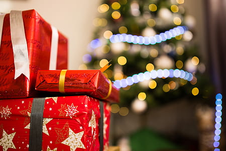selective focus photo of red Christmas gift boxes thumbnail