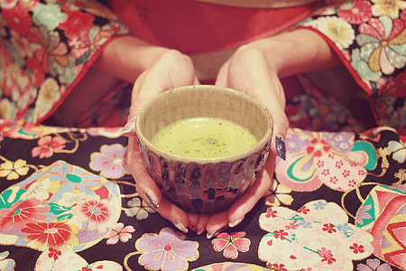 human hands holding bowl of soup thumbnail
