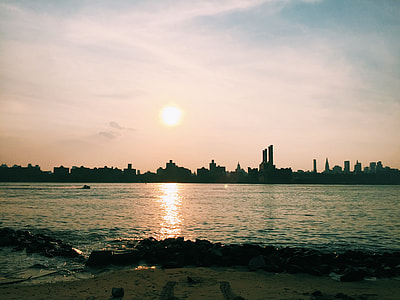 photo of city building near body of water thumbnail