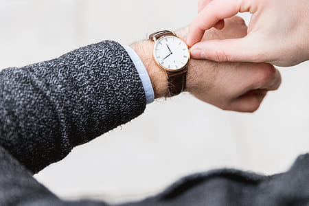 Man with clock checks the time thumbnail