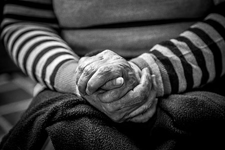 person with hands closed together thumbnail