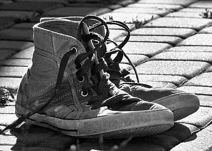 grayscale photography of high-top sneakers thumbnail