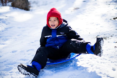 girl sliding on snow thumbnail