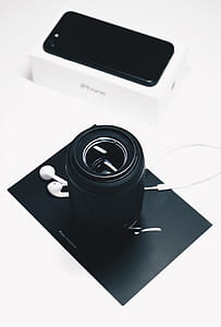black camera lens near box of iPhone 7 thumbnail