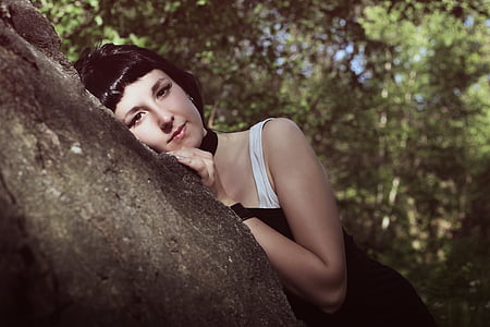 woman lying on tree trunk thumbnail