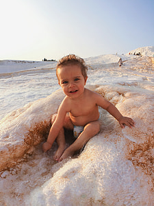 child playing with sand thumbnail
