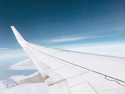 left passenger plane wing during daytime thumbnail