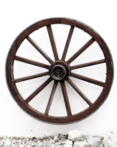 photo of brown wooden horse trailer wheel hanged on wall thumbnail