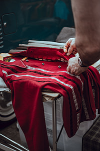 person unbutton of red dress shirt thumbnail