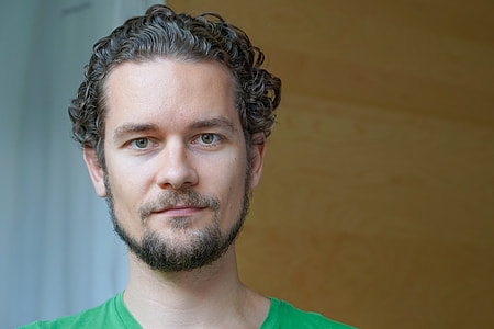 man wearing green crew-neck shirt thumbnail