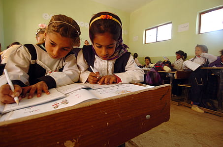 two girl's writing thumbnail