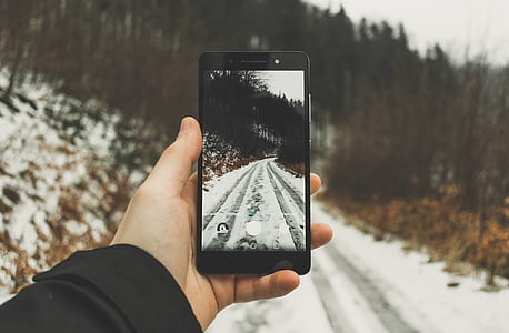 person holding smartphone during daytime thumbnail