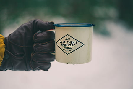 person holding white mug thumbnail