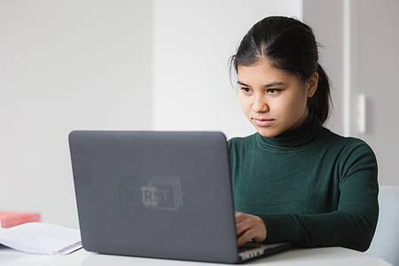 Serious Woman With Laptop Photo thumbnail