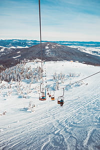 cable car running through snowy field thumbnail