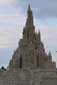 brown sand castle under cloudy sky during daytime thumbnail