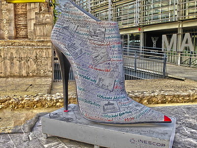 multicolored leather pump on book thumbnail