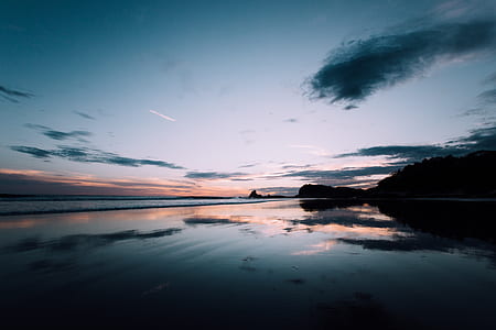 body of water during sunset thumbnail