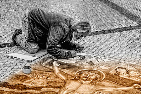 man painting crucifixion on the road thumbnail