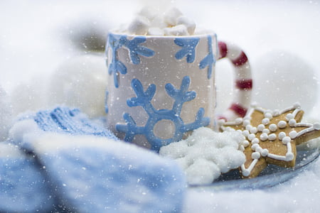 white and blue ceramic mug beside biscuit thumbnail