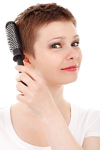 woman combing her hair thumbnail