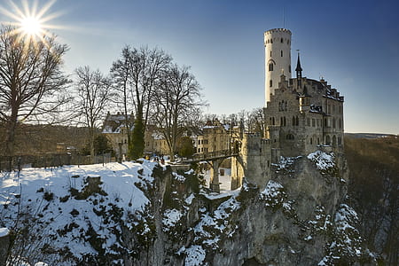 brown castle near the cliff at daytime thumbnail