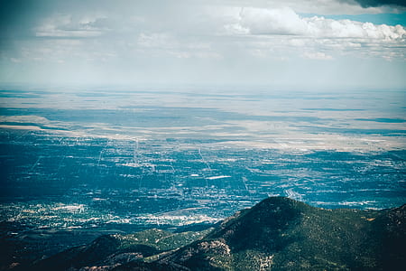 photo of mountain under white sky thumbnail