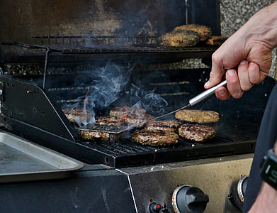 person grilling burger patties thumbnail
