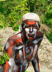 man in white and brown body paint thumbnail