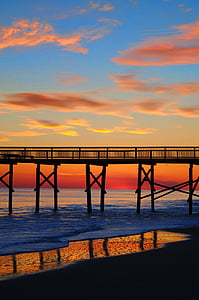 brown wooden dock at golden hour thumbnail