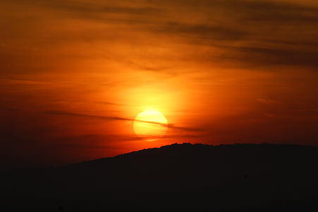 silhouette of mountain at sunset thumbnail