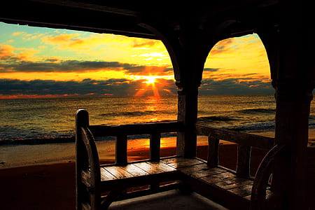 sea near house during sunset thumbnail