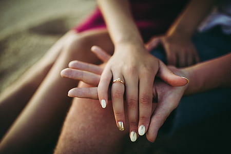 selective focus photography of woman's hand with ring thumbnail