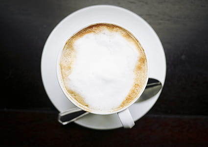white and brown liquid in white mug on saucer thumbnail