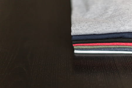 Tees On Wood Table Photo thumbnail