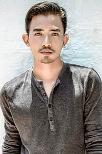 man wearing grey Henley button shirt thumbnail