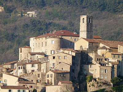 gray houses near mountain thumbnail